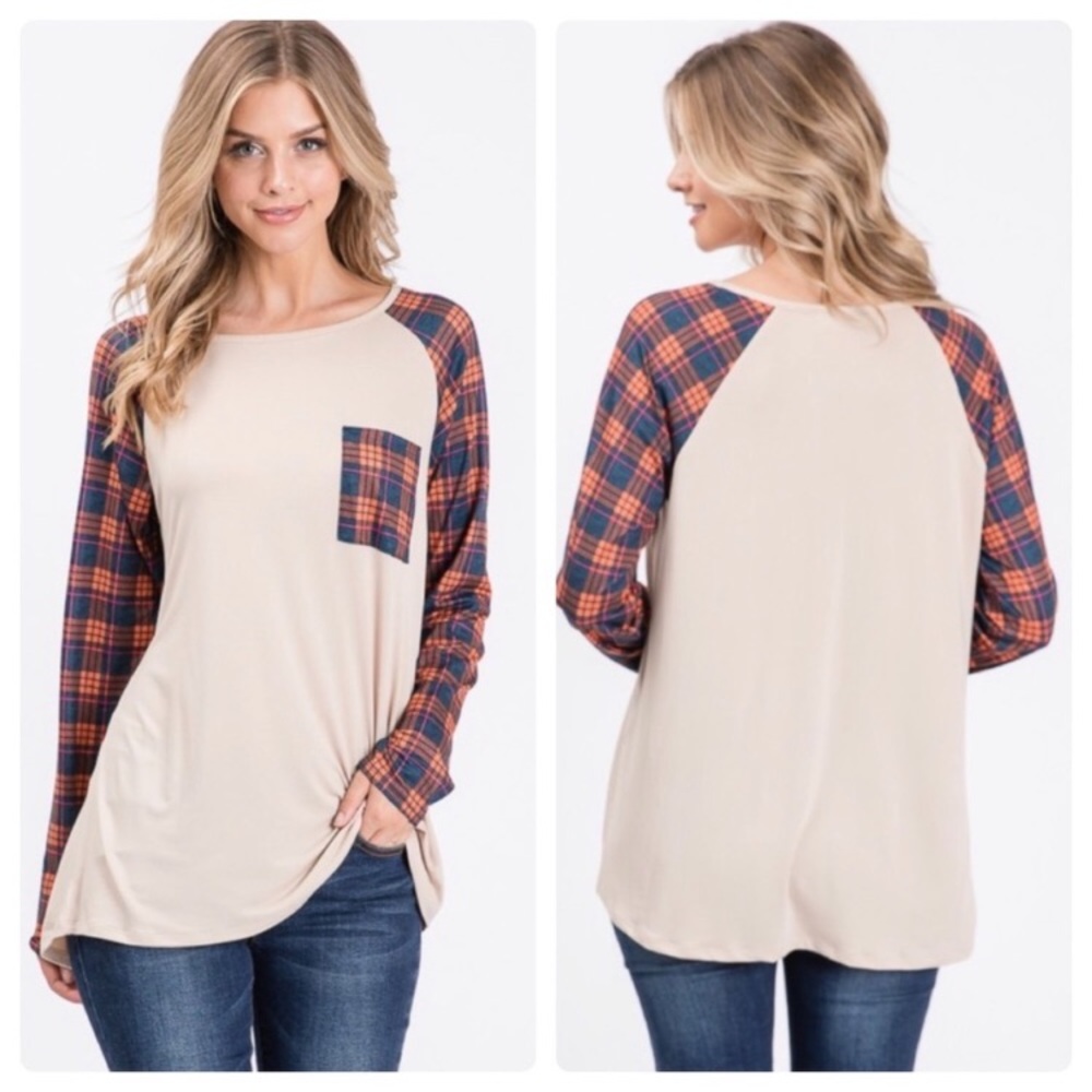 Long sleeve top with plaid sleeves.